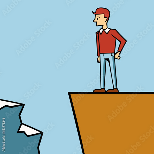 Man standing at the edge of a cliff looking down silhouette.