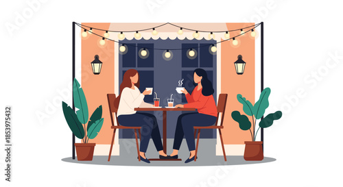 Two female friends having a conversation and drinking coffee at a cozy outdoor restaurant table illuminated by beautiful decorative light bulbs.