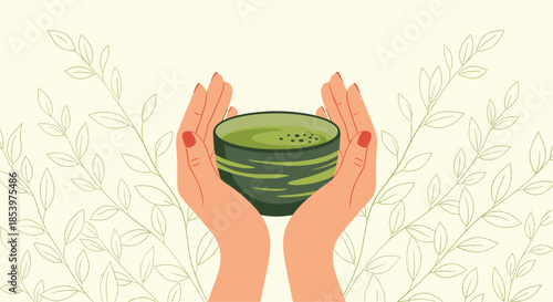 Pair of hands carefully holding a traditional ceramic bowl filled with green matcha tea against a background of delicate plant leaf patterns.