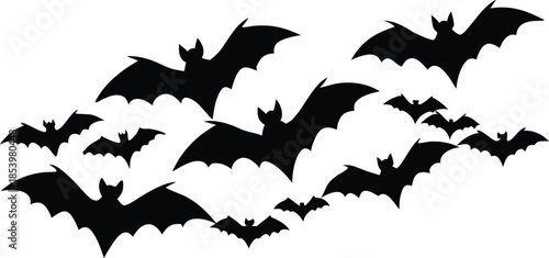 Spooky Halloween design featuring a black silhouette vector illustration of flying vampire bats icon with dark wings isolated on a white background
