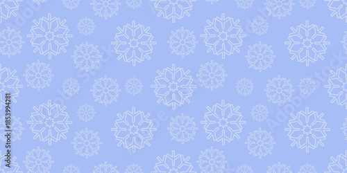 Minimal winter seamless pattern with large and small snowflakes on soft light blue background. Ideal for holiday textiles, winter wallpapers and seasonal surface design