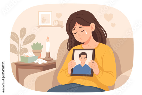 Emotional young woman holding photo, mourning loss in cozy home setting