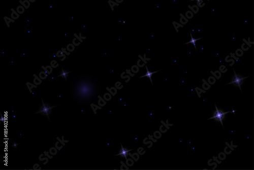 Blue dust and glowing star particles scattered across a black background. Magical sparkling abstract texture.
