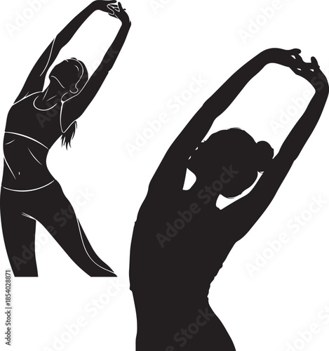 Silhouette of woman stretching arms up in yoga pose 