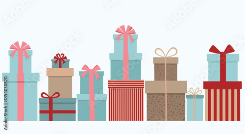 Array of various sized gift boxes wrapped in teal brown and red paper with beautiful bows ready for a special celebration.