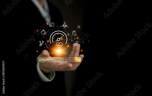 Businessman show his hand with the floating health and longevity icons, symbolizing wellness innovation, digital healthcare, search engine and future lifestyle technology.