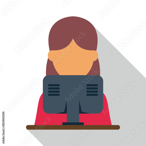 Woman sitting at a desk, looking at a computer monitor