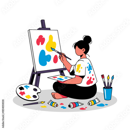 Creative female artist painting colorful abstract shapes on canvas in a bright studio space