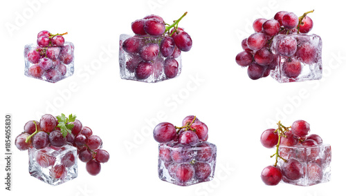 Red grapes in ice cubes isolated.