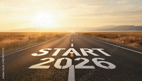 Wallpaper Mural START 2026 message painted on an endless desert highway during a dramatic golden sunset, representing the future, new resolutions, goals, and the beginning of a journey. Torontodigital.ca