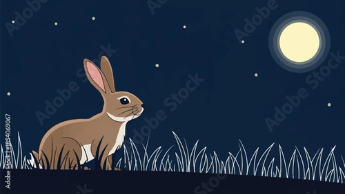 Brown rabbit sitting in moonlit grassy field at night