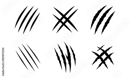 Collection of six different black claw marks and scratches on a white background