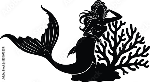 Silhouette of a mermaid sitting on coral reef
