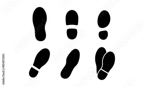 Collection of black shoe print silhouettes on a white background