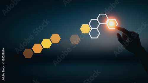 A user's hand interact with illuminated hexagons, symbolizing innovation and technological advancement in a futuristic and conceptual design.