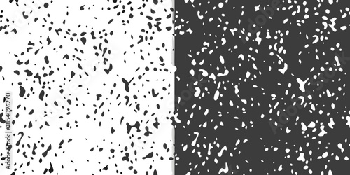 A stark contrast black and white speckled pattern dividing the frame vertically