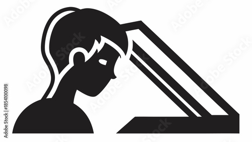 Silhouette of a person looking at a computer screen intently