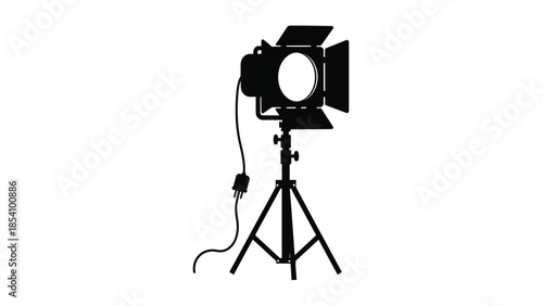 A black silhouette of a spotlight on a tripod stand