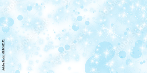 Abstract water drops and bubbles create a bright winter bokeh background with blue glitter, glowing holiday snow patterns, and a blurred Xmas design featuring shining light circles and sparkles