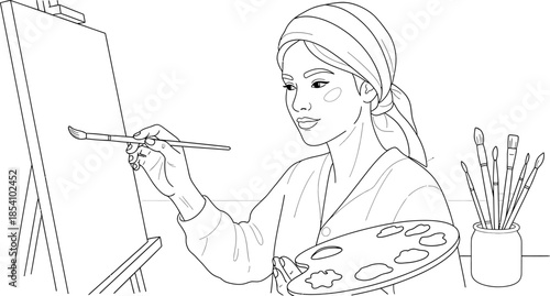 woman holding paintbrush and palette standing in front of an easel with a canvas