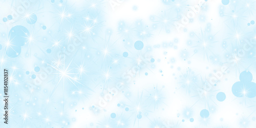 Shiny blue winter background with water drops and bokeh light snowflakes creates a bright holiday design featuring blurred snowfall and glitter for a festive Christmas backdrop