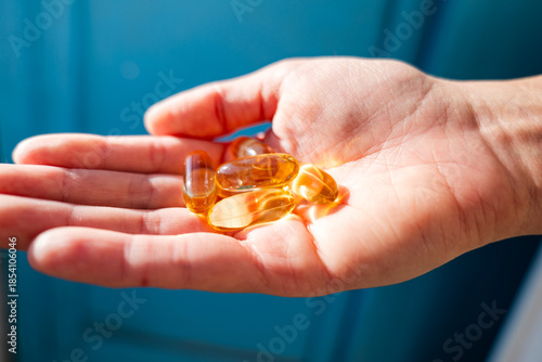 fish oil Omega-3 capsule or fish oil Omega-3 supplement close up. Healthy eating, medicine, health care, food supplements concept