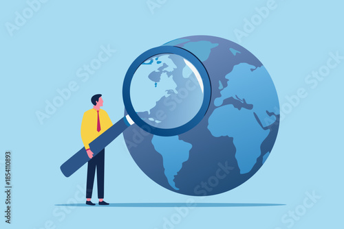 A person examining the world with a magnifying glass global research concept
