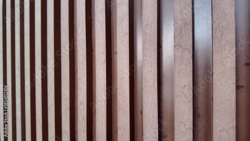 Vertical wooden slats with soft lighting
