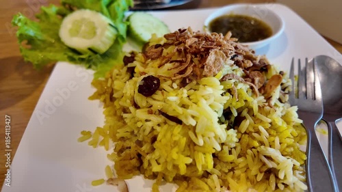 Biryani rice and Thai soup served together
