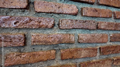 Rough textured brown brick wall background

