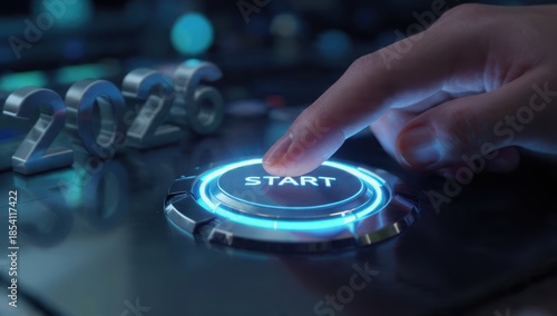 Launching 2026: Hand pressing a futuristic, glowing blue 'START' button. Concept symbolizing the initiation of new business strategies, future technology adoption, and corporate goals.