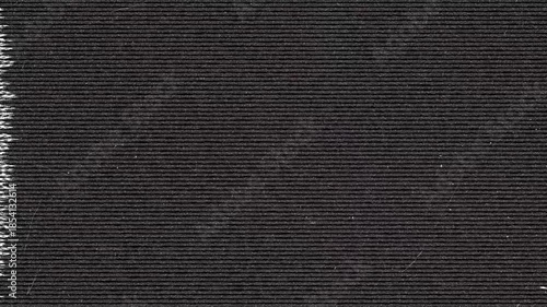 Close-up of textured dark paper with horizontal lines