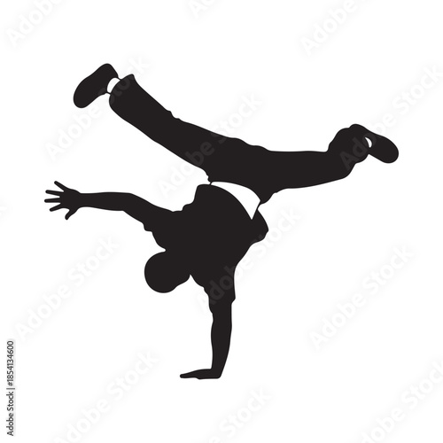 Silhouette of a breakdancer performing a dynamic handstand pose