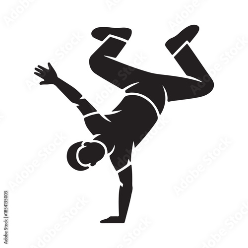 Silhouette of a person performing a dynamic handstand breakdance move