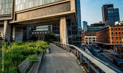New York, USA, 8 August 2025: Sunny path in High Line Park. Sunlit walkway with greenery in High Line Park New York.