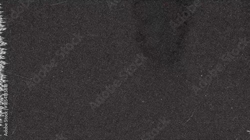 Close up look at dark textured Fabric with edge detail