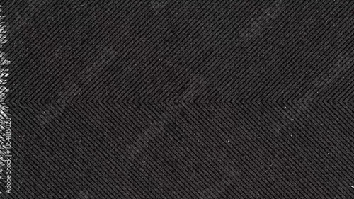 Close up of black fabric with herringbone weave pattern