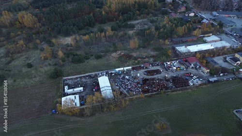 Scrapyard with machinery and metal heaps