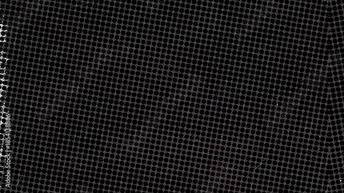 Close up of black perforated metal sheet pattern