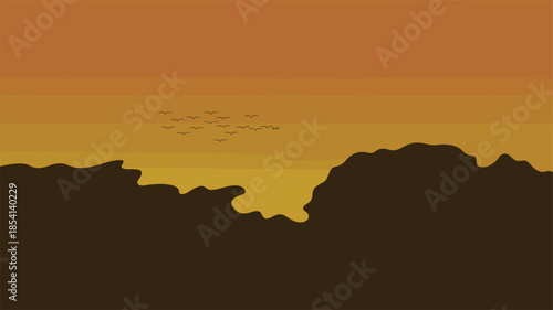 Serene sunset over mountains with birds flying in formation