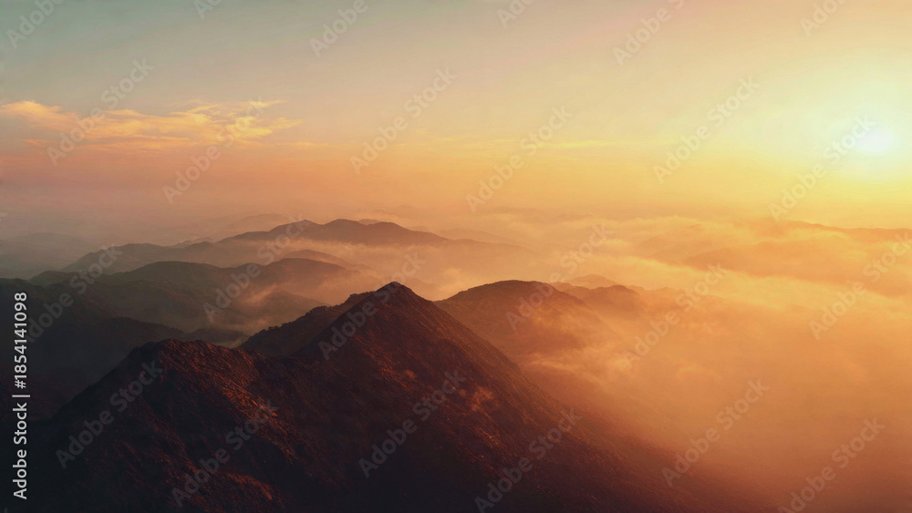 Fototapeta premium Mountains at Sunset with Fog