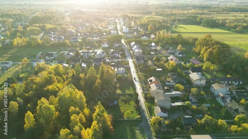 Countryside houses within colorful woodland