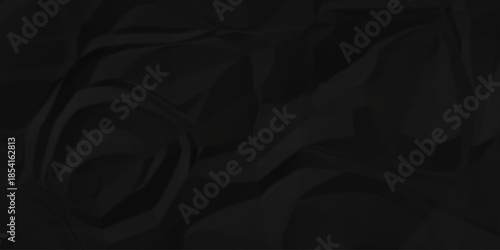 Crumple crushed black paper obsolete rumple craft design. wrinkle ripped creased crumple aged closeup recycled document grunge paper background.