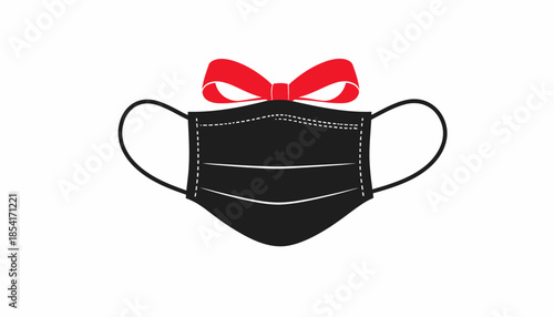 Black medical face mask decorated with a red bow on a white background.
