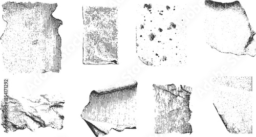 Collection of eight black and white textured grunge paper scraps with torn edges