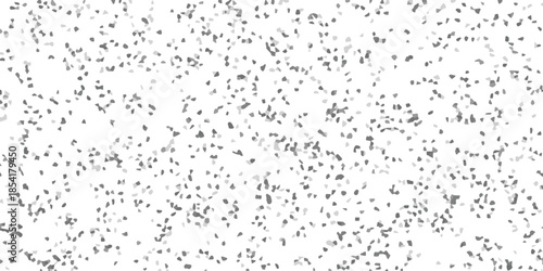 Abstract grayscale mosaic pattern with scattered irregular shapes on a white background for graphic design and texture applications