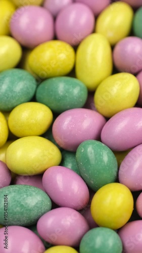 Multicolored candies close up, rotation. Assorted colorful chocolate candies