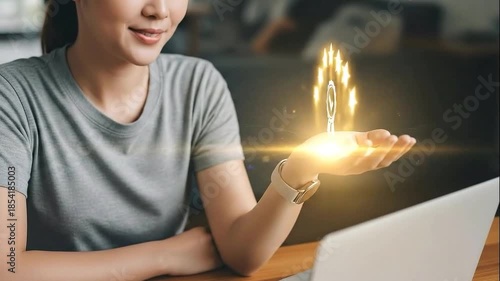 Woman holding a five star rating icon near laptop