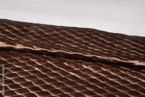 Elegant modern bedsheet with soft fabric texture, neatly arranged on a bed, showcasing comfort, cleanliness, and contemporary bedroom interior design