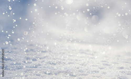 Sparkling white snow surface with falling bright bokeh lights on a chilly day on transparent background